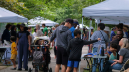 Adults and children alike get involved with community organizations at Parkfest. Photo by Ashley D’Souza.